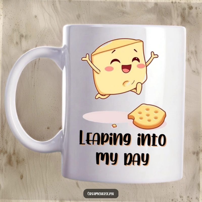 Funny mug featuring a cream cheese wedge joyfully jumping over a toppled cracker, embodying pure, uncontainable breakfast delight.