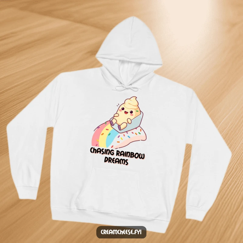 Funny anthropomorphic cream cheese tub hoodie happily sliding down a rainbow sprinkle slope, cozy and full of fun.