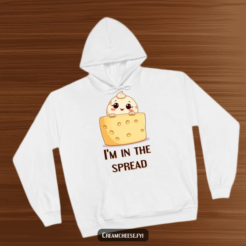 Funny and cozy cream cheese character hoodie, peeking curiously from a cheese board, ideal gift for winter comfort and laughs.