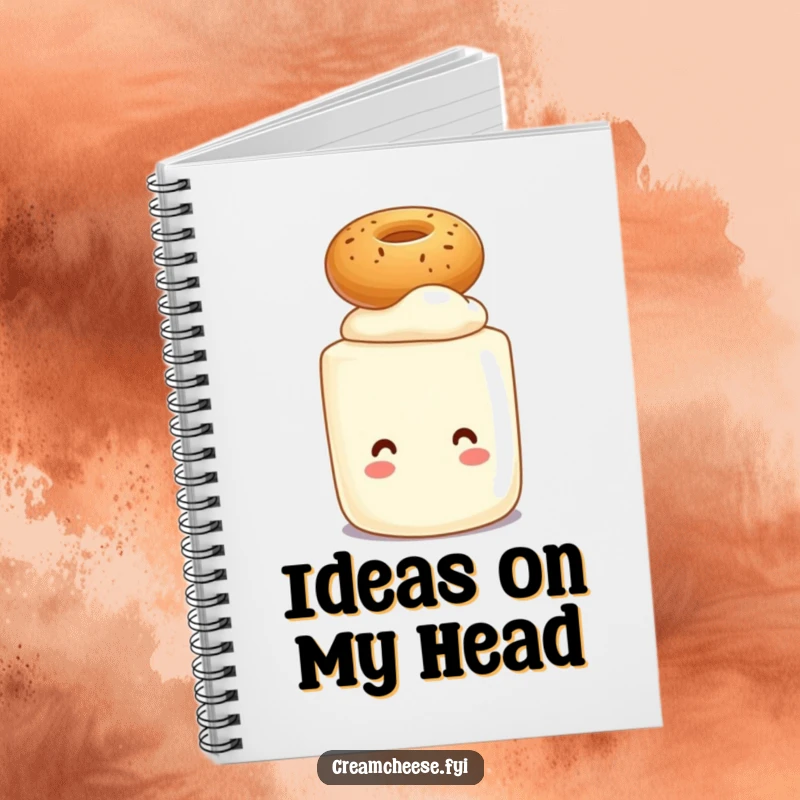 Funny notebook with a cream cheese tub character balancing a small bagel on its head, perfect for jotting down ideas.