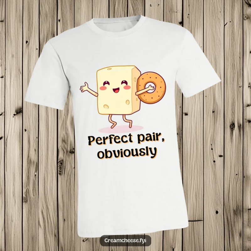Funny t-shirt depicting a smiling cream cheese block with legs doing a joyful dance with a happy bagel.