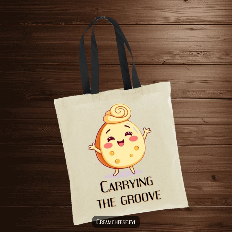Funny tote bag featuring a cream cheese wheel dancing gleefully, adorned with a festive cinnamon swirl hat, for stylish carrying.